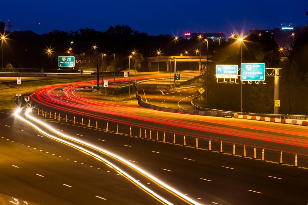Night exposure capture of cars traveling the Greenway